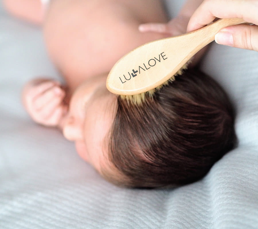Baby hairbrush with natural bristles