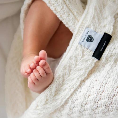 Baby in a merino wool blanket from Lullalove