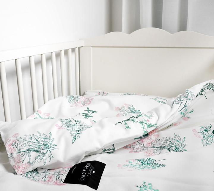 White cot bed with duvet
