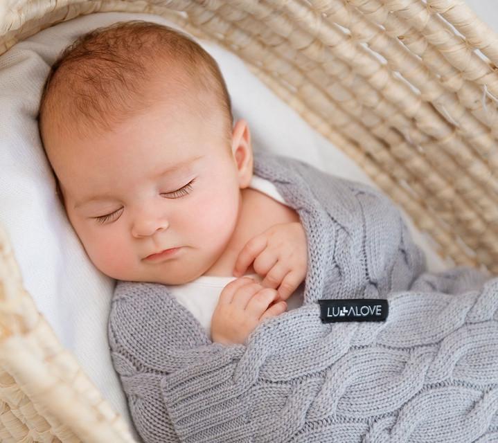 Baby in a grey merino wool blanket